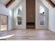 Bright living room with a modern fireplace, wood floors, and large windows at 859 N Bay Overlook, Villa Rica, GA 30180