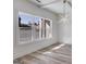 Bright living room with a modern light fixture, a big window, and stylish floors at 859 N Bay Overlook, Villa Rica, GA 30180