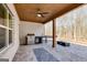 A covered outdoor kitchen with a stainless steel grill and a fire pit offers a seamless transition to outdoor living at 859 N Bay Overlook, Villa Rica, GA 30180