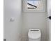 Modern toilet room featuring an automatic toilet and an electric outlet at 859 N Bay Overlook, Villa Rica, GA 30180
