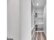 Walk-in closet with custom shelving, and wood look flooring at 859 N Bay Overlook, Villa Rica, GA 30180