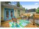 Cozy back porch featuring outdoor seating, a wooden deck, and a view of the backyard at 1273 Boulevard Lorraine Sw, Atlanta, GA 30311