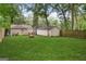 Spacious backyard with lush green grass, a fire pit, and plenty of room for outdoor activities at 1273 Boulevard Lorraine Sw, Atlanta, GA 30311