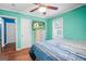 Bedroom with hardwood floors, television and ceiling fan, plus natural light from the window at 1273 Boulevard Lorraine Sw, Atlanta, GA 30311