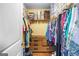 Organized walk-in closet with ample storage solutions, including shelves, rods, and drawers at 1273 Boulevard Lorraine Sw, Atlanta, GA 30311