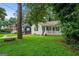 Quaint home with a covered front porch and a beautifully landscaped front yard at 1273 Boulevard Lorraine Sw, Atlanta, GA 30311