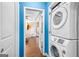 Convenient laundry area with a stacked washer and dryer and easy access to other rooms at 1273 Boulevard Lorraine Sw, Atlanta, GA 30311