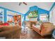 Open concept living room with fireplace, hardwood floors, and plenty of natural light at 1273 Boulevard Lorraine Sw, Atlanta, GA 30311
