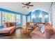 Open concept living room with ample seating, hardwood floors and natural light at 1273 Boulevard Lorraine Sw, Atlanta, GA 30311