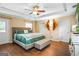 Spacious bedroom with a tray ceiling, hardwood floors, and ample natural light at 1273 Boulevard Lorraine Sw, Atlanta, GA 30311