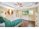 Bright and airy main bedroom with hardwood floors, a ceiling fan, and large windows at 1273 Boulevard Lorraine Sw, Atlanta, GA 30311