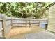 Fenced back yard is small and is located next to the air conditioning condenser at 1406 Bayrose Cir # 6B, East Point, GA 30344