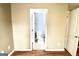 Bathroom entryway showcasing a toilet with gray walls and a light-colored floor at 1406 Bayrose Cir # 6B, East Point, GA 30344