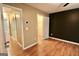 Neutral bedroom featuring hardwood floors, a closet, and a door to another room at 1406 Bayrose Cir # 6B, East Point, GA 30344