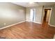 Bright bedroom with hardwood floors and an open doorway to the bathroom at 1406 Bayrose Cir # 6B, East Point, GA 30344