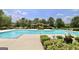 Community pool with landscaping, lounge chairs and trellises at 1406 Bayrose Cir # 6B, East Point, GA 30344