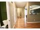 Entryway view showing a powder room, stairs and kitchen with breakfast bar at 1406 Bayrose Cir # 6B, East Point, GA 30344