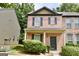 Attractive two-story brick townhome with dark shutters and a manicured front yard at 1406 Bayrose Cir # 6B, East Point, GA 30344