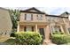 Charming two-story brick townhome with a covered front porch and manicured landscaping at 1406 Bayrose Cir # 6B, East Point, GA 30344