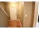 Inviting foyer featuring a white front door and wood-look floors that welcome you into this charming home at 1406 Bayrose Cir # 6B, East Point, GA 30344