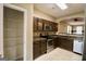The kitchen features stainless steel appliances, dark cabinets, and a walk-in pantry, ideal for home cooking and storage at 1406 Bayrose Cir # 6B, East Point, GA 30344