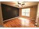 Large main bedroom with hardwood floors, ceiling fan and natural light at 1406 Bayrose Cir # 6B, East Point, GA 30344