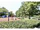 Neighborhood playground with swings and climbing structures, near the community pool at 1406 Bayrose Cir # 6B, East Point, GA 30344