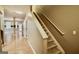 View of the carpeted staircase featuring a white handrail leading to the upper level with hardwood floors below at 1406 Bayrose Cir # 6B, East Point, GA 30344