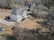 Aerial view of the property showcasing the house, deck, backyard, and mature trees at 123 Stratmore Pl, Stockbridge, GA 30281