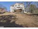 A view of the back of the house showing a large grassy backyard and deck at 123 Stratmore Pl, Stockbridge, GA 30281