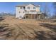 View of the back of the house with deck and large grassy backyard at 123 Stratmore Pl, Stockbridge, GA 30281