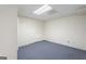 Basement with blue carpet, neutral color walls and a drop ceiling at 123 Stratmore Pl, Stockbridge, GA 30281