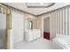 Bathroom featuring a vanity, shower, and jacuzzi at 123 Stratmore Pl, Stockbridge, GA 30281