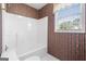 Bathroom featuring a tub/shower combination and a window for natural light at 123 Stratmore Pl, Stockbridge, GA 30281