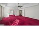 Spacious bedroom featuring red carpet, tray ceiling and white trim at 123 Stratmore Pl, Stockbridge, GA 30281