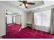 Bedroom with a ceiling fan, tray ceiling, and vanity at 123 Stratmore Pl, Stockbridge, GA 30281