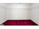 Empty closet with adjustable white wire shelving and red carpet at 123 Stratmore Pl, Stockbridge, GA 30281