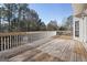 Spacious deck with natural wood and white railing, perfect for outdoor entertaining at 123 Stratmore Pl, Stockbridge, GA 30281