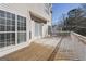 Wide wooden deck with a white railing, ideal for enjoying outdoor living at 123 Stratmore Pl, Stockbridge, GA 30281