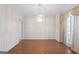 Elegant dining room featuring hardwood floors, chandelier, and neutral walls at 123 Stratmore Pl, Stockbridge, GA 30281