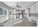 Spacious eat-in kitchen with white cabinets, tile floors, and ample counter space with windows at 123 Stratmore Pl, Stockbridge, GA 30281