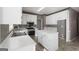 Kitchen featuring white cabinets, stainless steel appliances, and a kitchen island at 123 Stratmore Pl, Stockbridge, GA 30281