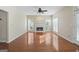 Bright living room featuring a fireplace, ceiling fan, and gleaming hardwood floors at 123 Stratmore Pl, Stockbridge, GA 30281