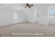 Spacious bonus room with neutral carpet and natural light from multiple windows at 930 Laurel Brooke Ave, Peachtree City, GA 30269