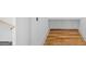 Bright, efficient closet with wooden floors and white custom shelving for maximum storage at 930 Laurel Brooke Ave, Peachtree City, GA 30269