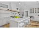 Elegant kitchen features a large island, stainless appliances, and hardwood floors at 930 Laurel Brooke Ave, Peachtree City, GA 30269