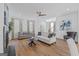 Spacious and bright living room with hardwood floors, fireplace, and neutral furnishings at 930 Laurel Brooke Ave, Peachtree City, GA 30269