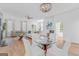 Open-concept living space with a dining area, hardwood floors, and lots of natural light at 930 Laurel Brooke Ave, Peachtree City, GA 30269