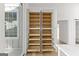 Open pantry featuring pull out shelves and cabinets, showcasing a wealth of storage solutions at 930 Laurel Brooke Ave, Peachtree City, GA 30269