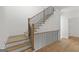 Staircase with wood treads and black metal railings at 930 Laurel Brooke Ave, Peachtree City, GA 30269
